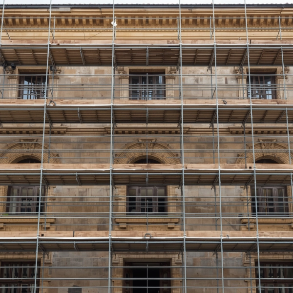 Contractor reviewing renovation drawings with AI-assisted takeoff interface